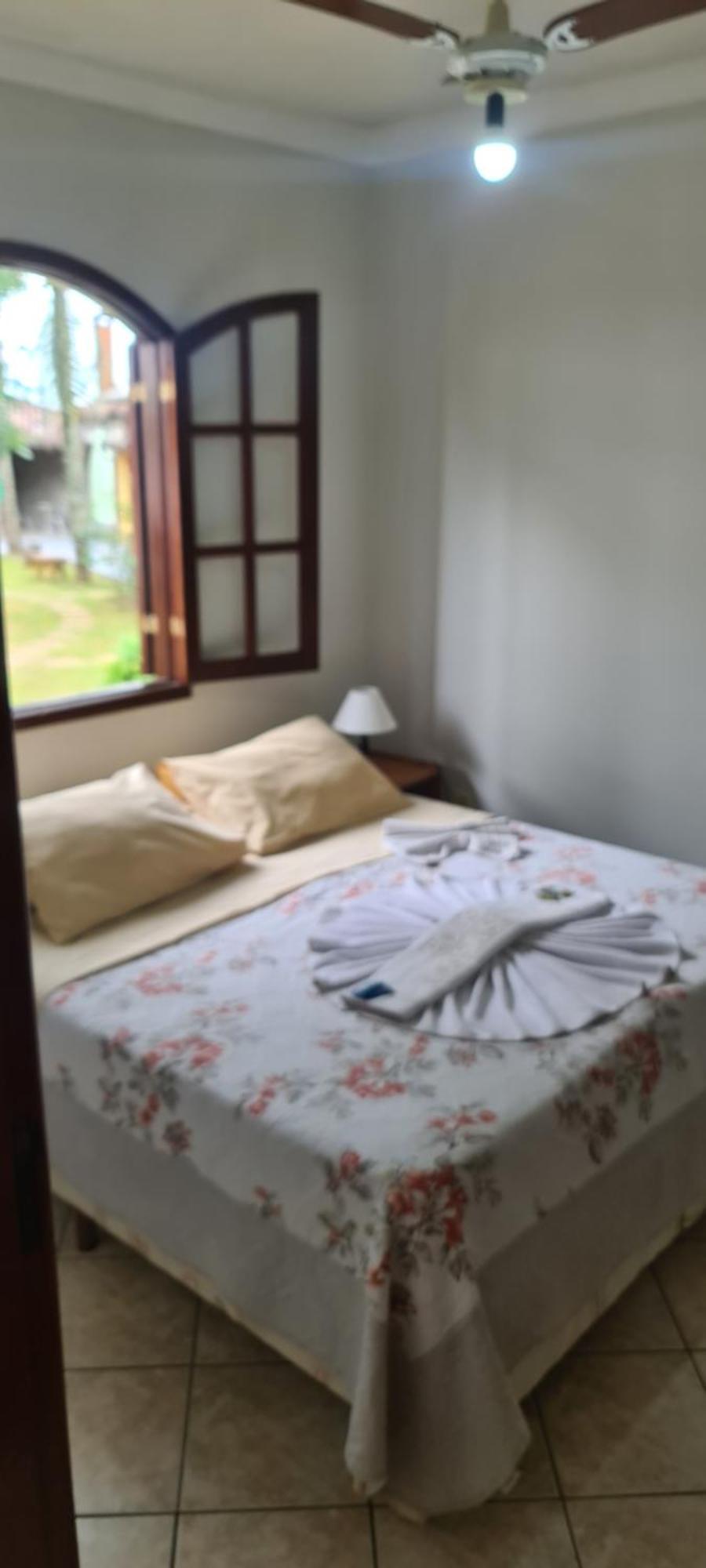 Pousada Nossa Senhora Penedo  Pokój zdjęcie A bed with a bathrobe
